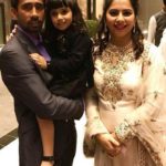 Romi Saha with her husband and daughter
